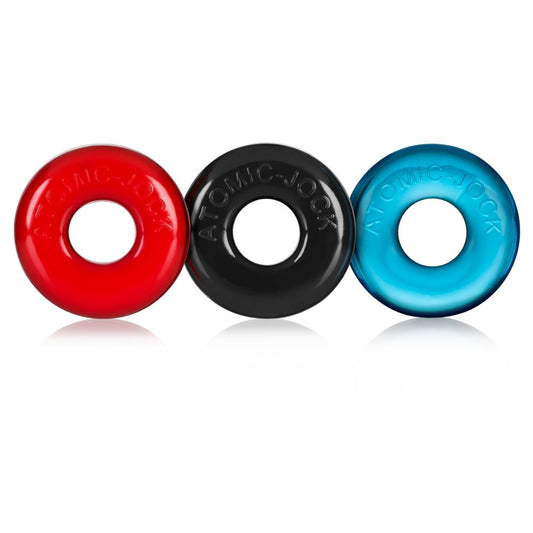  OxBalls Ringer Set of 3 Cock Rings. SKU: OX-1324-MULTI A Set of 3 mixed coloured cock rings. One red, one black and one blue. They have a smooth texture with the words Atomic Jock embossed onto the front. The look thick and a bit like skateboard tyres. They have a slight shine to them.