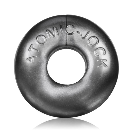 OxBalls Ringer Set of 3 Cock Rings. SKU:  OX-1324-STL. A close up of one of the steel silver cock rings. It has a smooth texture with the words Atomic Jock embossed onto the front. It looks thick and a bit like a skateboard tyre. It has a slight glittering shine to it.